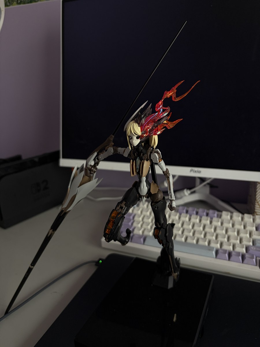 Gundam model displayed in front of a monitor